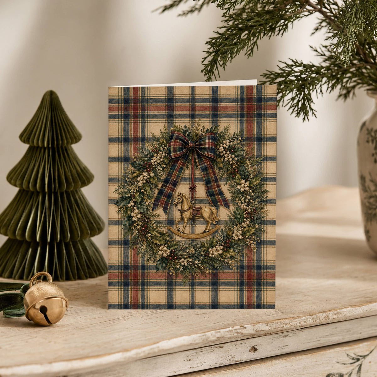 Une carte de Noël avec un cheval à bascule